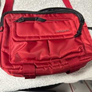 Red with black zipper, excellent shape, nylon